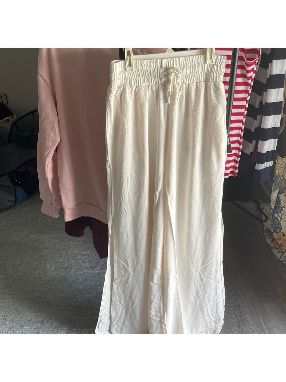Women's Wide Leg Cream Pants. New with tag. With slits up the legs and pockets